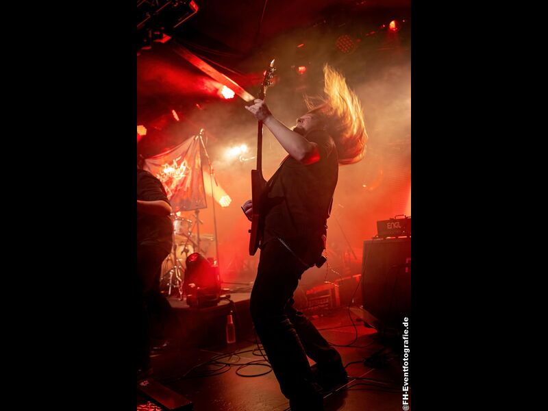 Dark Lightning live in front of the band banner, 9th December 2022. Photo: FH-Eventfotografie